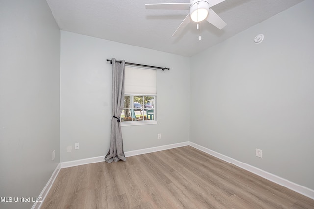 209 Audrey Cir, Ocean Springs, MS 39564 - unfurnished room with light wood finished floors, ceiling fan, and baseboards