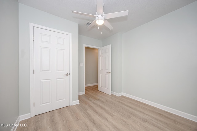 209 Audrey Cir, Ocean Springs, MS 39564 - unfurnished bedroom featuring light wood-style floors, baseboards, and ceiling fan
