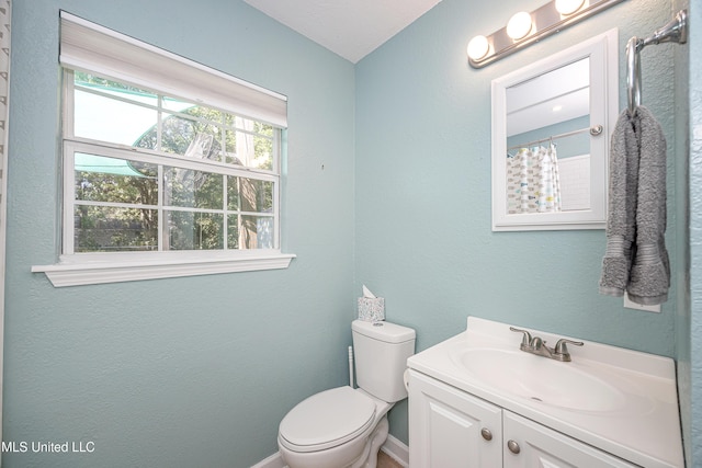 209 Audrey Cir, Ocean Springs, MS 39564 - bathroom with vanity, toilet, and baseboards