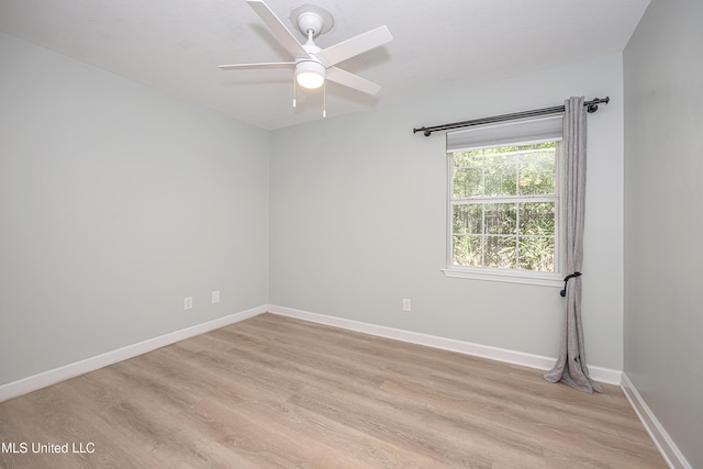 209 Audrey Cir, Ocean Springs, MS 39564 - unfurnished room featuring light wood-style flooring, a ceiling fan, and baseboards