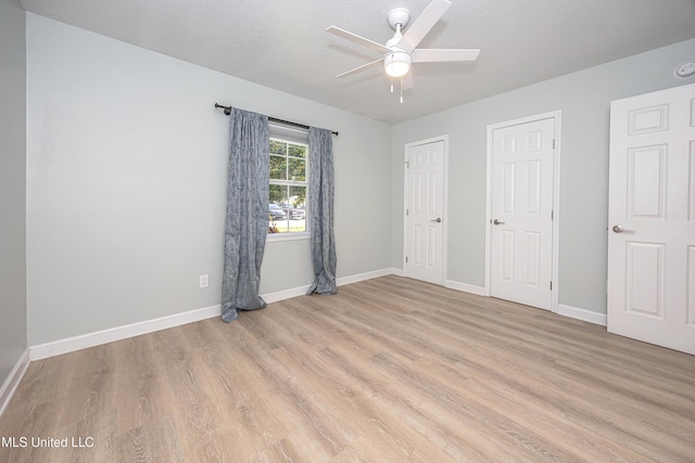 209 Audrey Cir, Ocean Springs, MS 39564 - unfurnished bedroom with light wood finished floors, baseboards, and a ceiling fan
