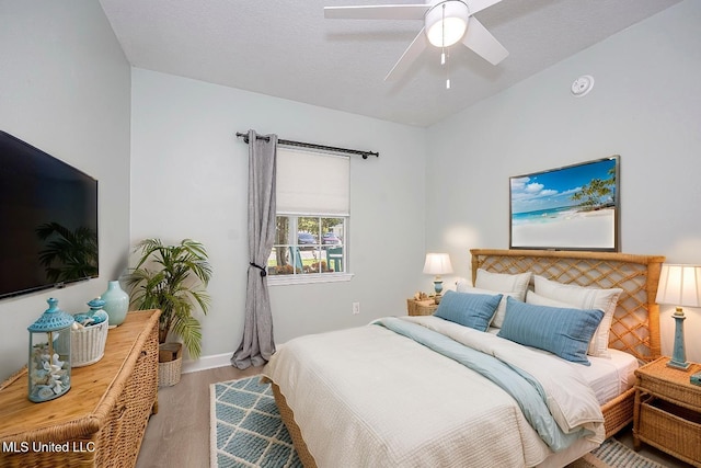 209 Audrey Cir, Ocean Springs, MS 39564 - bedroom with wood finished floors, baseboards, and a ceiling fan