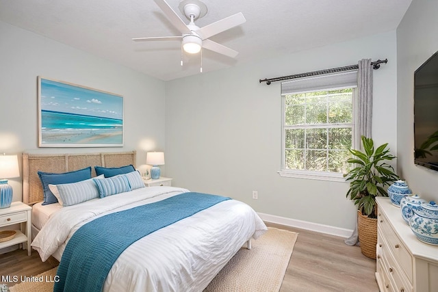 209 Audrey Cir, Ocean Springs, MS 39564 - bedroom with light wood-style flooring, baseboards, and ceiling fan