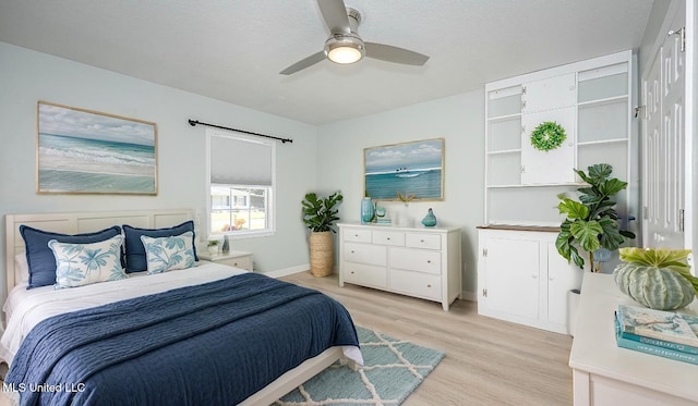209 Audrey Cir, Ocean Springs, MS 39564 - bedroom with light wood-type flooring, baseboards, and ceiling fan