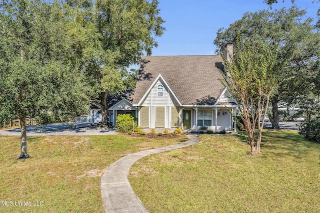 view of front of property with a porch and a front yard