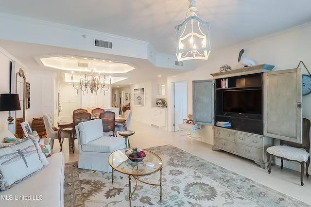 2668 Beach Blvd Unit 1704, Biloxi, MS 39531 - living area with a chandelier, ornamental molding, and a tray ceiling