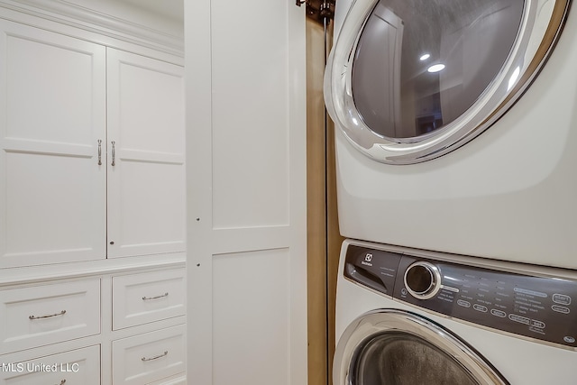 2668 Beach Blvd Unit 1704, Biloxi, MS 39531 - laundry room with stacked washing machine and dryer