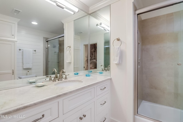 2668 Beach Blvd Unit 1704, Biloxi, MS 39531 - bathroom with a shower with door, ornamental molding, and vanity