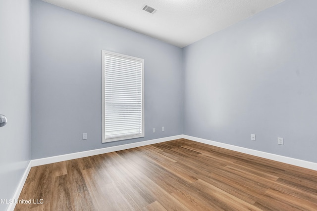 700 Martin Luther King Jr Dr, Holly Springs, MS 38635 - empty room with wood finished floors and baseboards