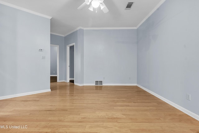 700 Martin Luther King Jr Dr, Holly Springs, MS 38635 - empty room featuring ceiling fan, ornamental molding, light wood finished floors, and baseboards