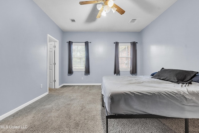 700 Martin Luther King Jr Dr, Holly Springs, MS 38635 - bedroom featuring baseboards, carpet, and a ceiling fan
