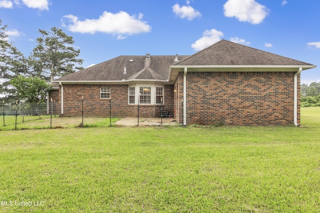 700 Martin Luther King Jr Dr, Holly Springs, MS 38635 - back of property featuring brick siding and a shingled roof