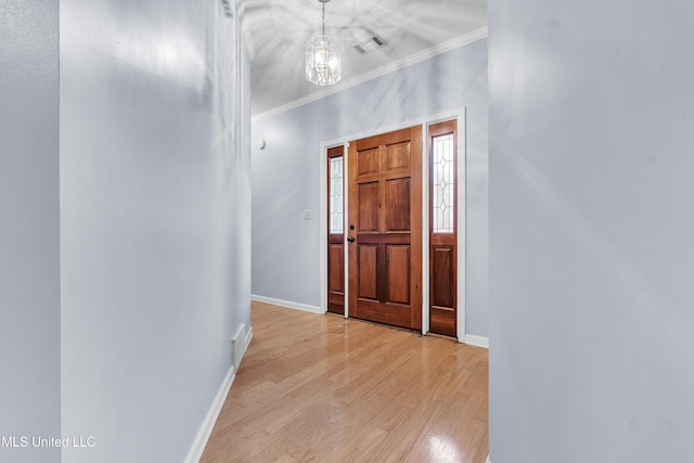 700 Martin Luther King Jr Dr, Holly Springs, MS 38635 - foyer featuring crown molding, baseboards, and light wood-style floors
