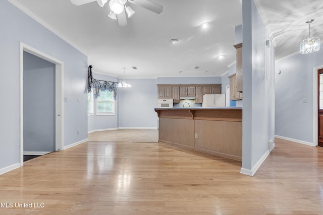 700 Martin Luther King Jr Dr, Holly Springs, MS 38635 - kitchen featuring white appliances, ceiling fan, ornamental molding, baseboards, and a peninsula