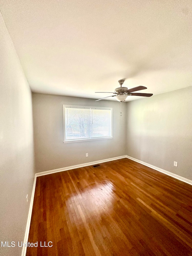 spare room featuring ceiling fan and wood-type flooring