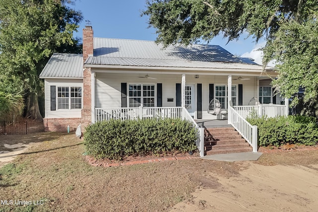 view of front of house with ceiling fan and covered porch