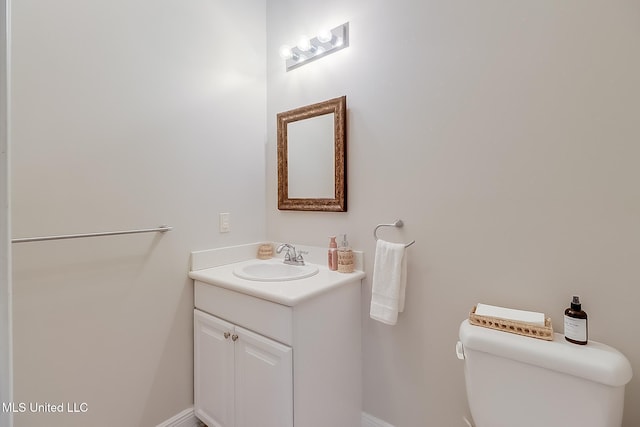 bathroom with toilet and vanity