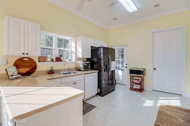 kitchen featuring white dishwasher, sink, ornamental molding, black fridge with ice dispenser, and white cabinetry