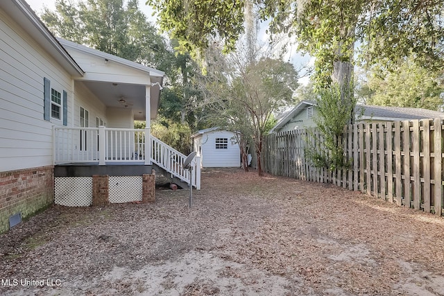 view of yard with a storage unit