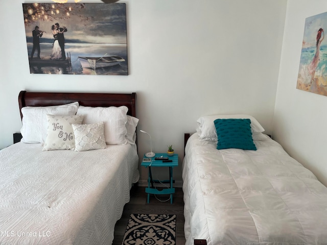 bedroom featuring wood-type flooring