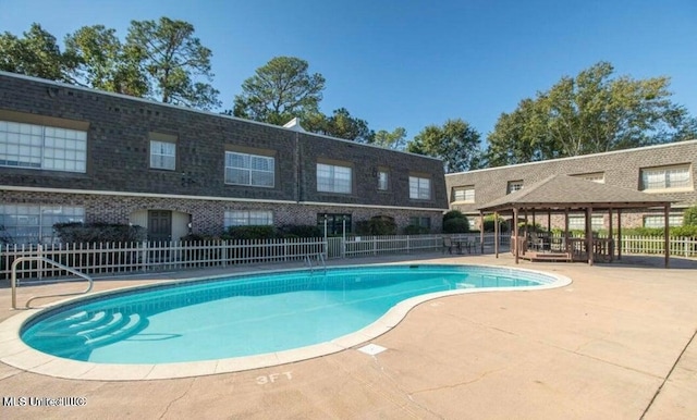 view of pool with a gazebo and a patio area