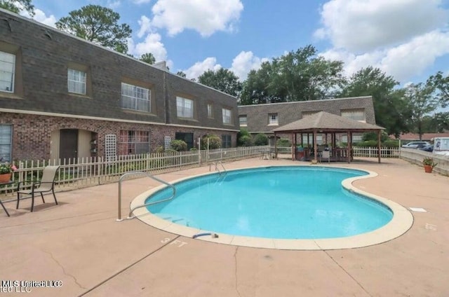 view of pool with a gazebo and a patio