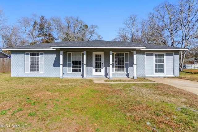 ranch-style house with covered porch and a front lawn