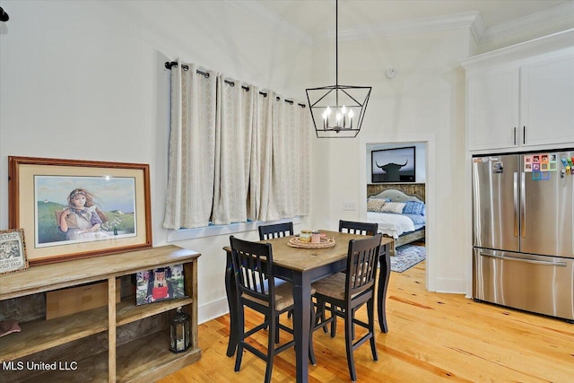 1622 Old Lake Rd, Brandon, MS 39042 - dining space featuring a chandelier, crown molding, and light wood-style floors