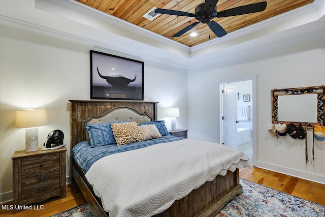 1622 Old Lake Rd, Brandon, MS 39042 - bedroom featuring a tray ceiling, crown molding, wood finished floors, ensuite bath, and wood ceiling