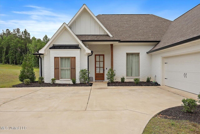 1622 Old Lake Rd, Brandon, MS 39042 - modern farmhouse with board and batten siding, driveway, a shingled roof, and a garage