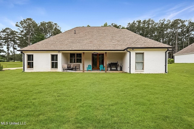 1622 Old Lake Rd, Brandon, MS 39042 - back of property with a yard, a patio, and a shingled roof