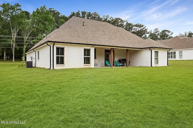 1622 Old Lake Rd, Brandon, MS 39042 - back of property with a lawn, cooling unit, and a shingled roof