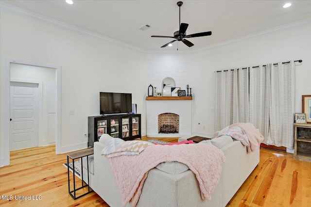 1622 Old Lake Rd, Brandon, MS 39042 - living room featuring wood finished floors, crown molding, ceiling fan, recessed lighting, and a fireplace