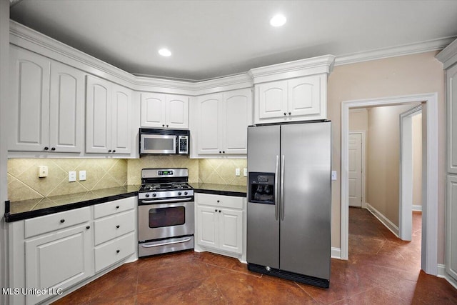 kitchen featuring appliances with stainless steel finishes, ornamental molding, white cabinetry, and backsplash