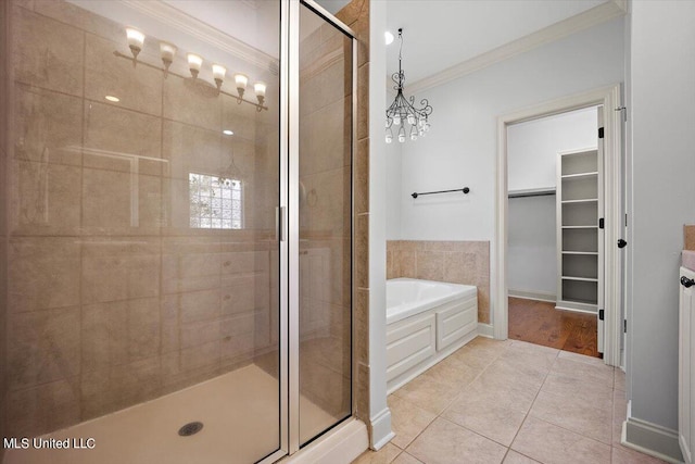 bathroom featuring tile patterned floors, ornamental molding, and plus walk in shower