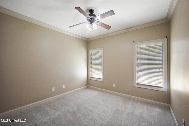 unfurnished room featuring ornamental molding, light colored carpet, and ceiling fan