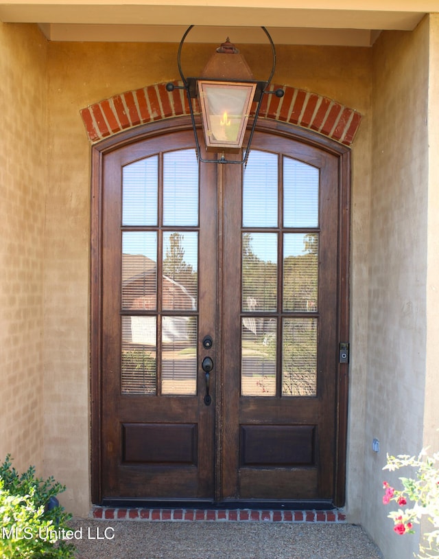 property entrance featuring french doors