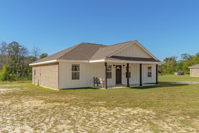 view of front of home with a front lawn and a porch