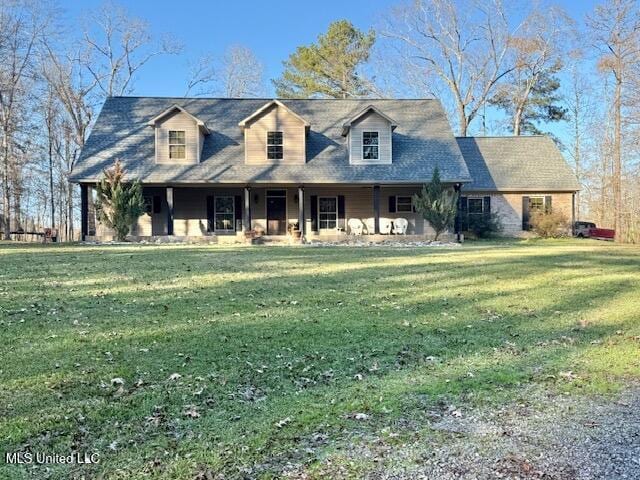 new england style home with a front yard