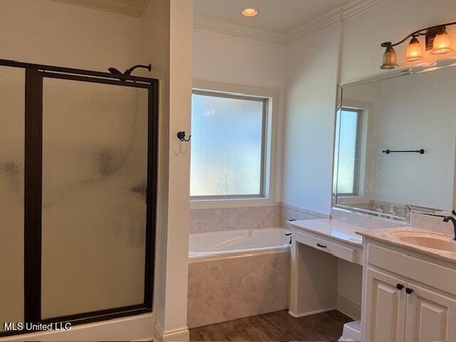 full bath with a garden tub, a shower stall, ornamental molding, and vanity