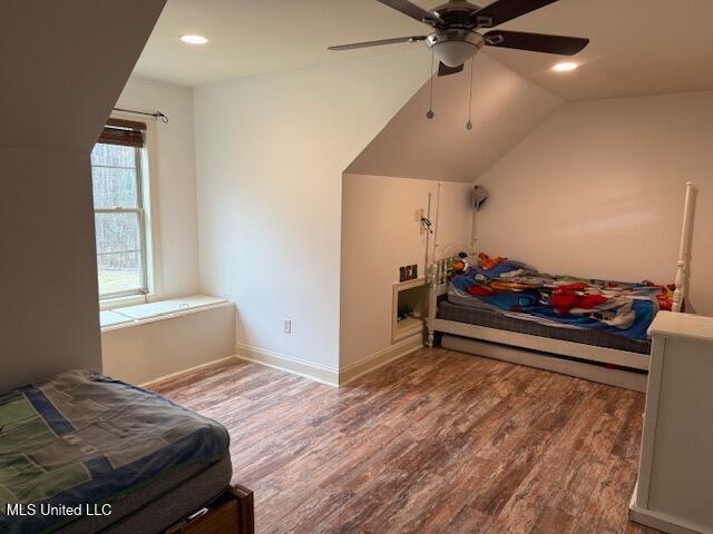 bedroom featuring ceiling fan, vaulted ceiling, wood finished floors, and recessed lighting