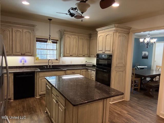 kitchen featuring a sink, a ceiling fan, ornamental molding, black appliances, and dark wood finished floors