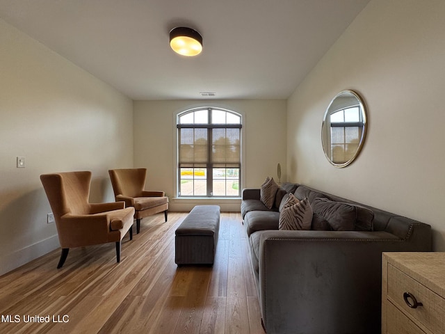 living room with light wood-style floors and baseboards