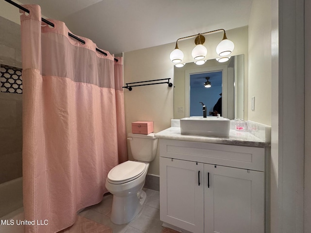 full bathroom with tile patterned floors, vanity, and toilet