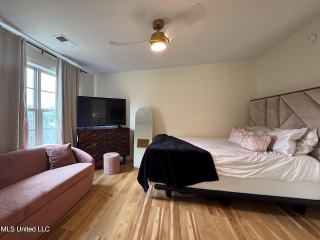 bedroom with light wood-type flooring and ceiling fan