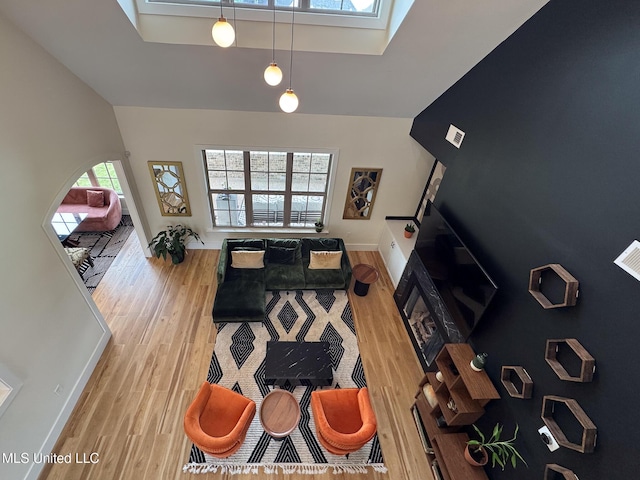 living area with wood finished floors and baseboards