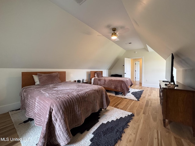 bedroom with light wood-style flooring, baseboards, lofted ceiling, and ceiling fan