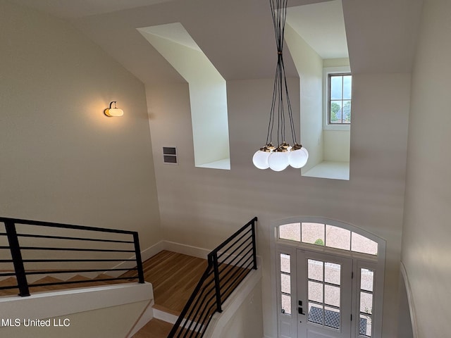 entrance foyer featuring baseboards and wood finished floors