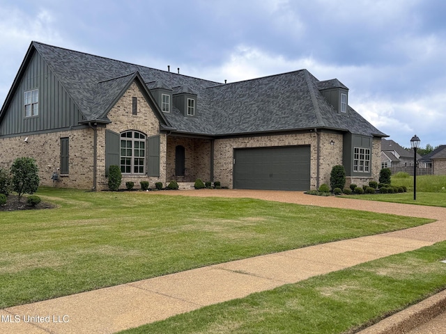 french country style house featuring brick siding, driveway, a shingled roof, and an attached garage