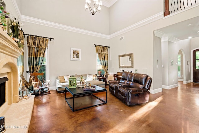 living room with concrete floors, a tile fireplace, and plenty of natural light